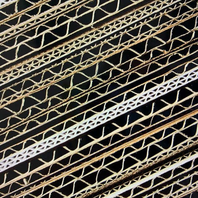 Sturdy and reliable corrugated cardboard, a versatile packaging material known for its strength and durability, commonly used for shipping and protecting various products during transportation.