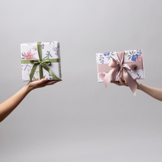 Vibrant and festive wrapping paper, featuring eye-catching patterns and colors, ready to add a touch of joy and excitement to your gifts.